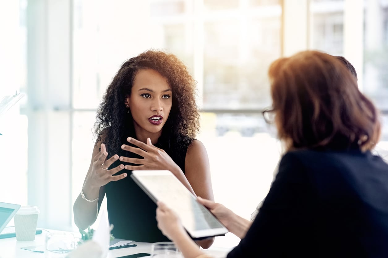 Two women talk business