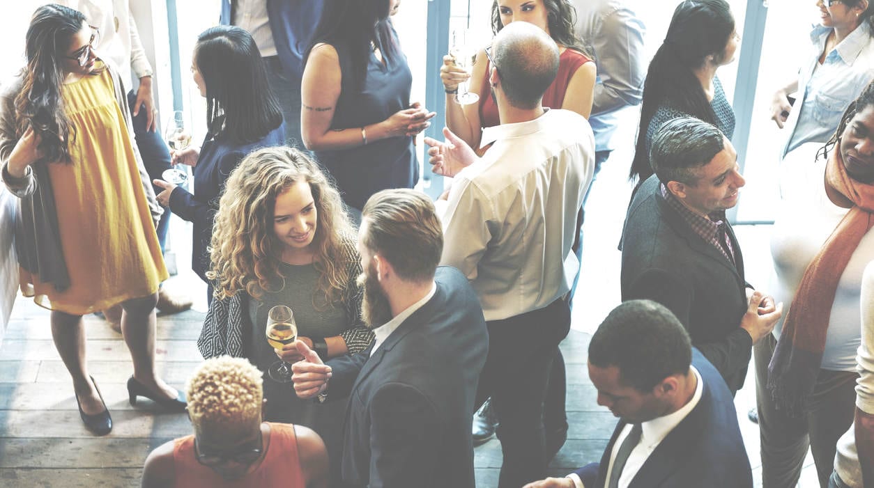 business professionals networking at event