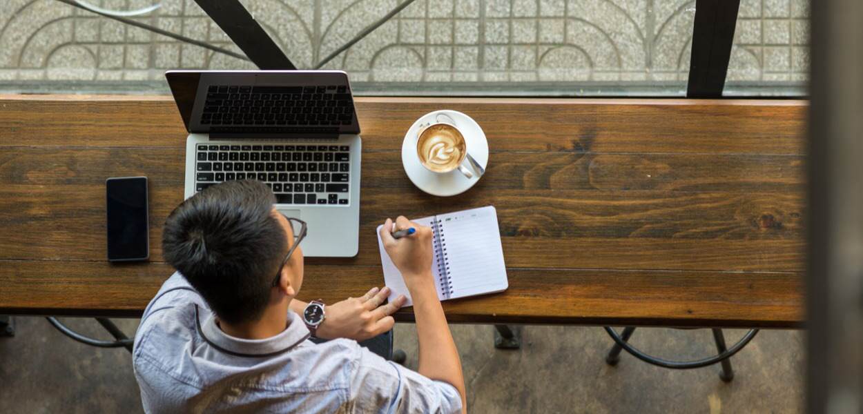 young businessman making notes