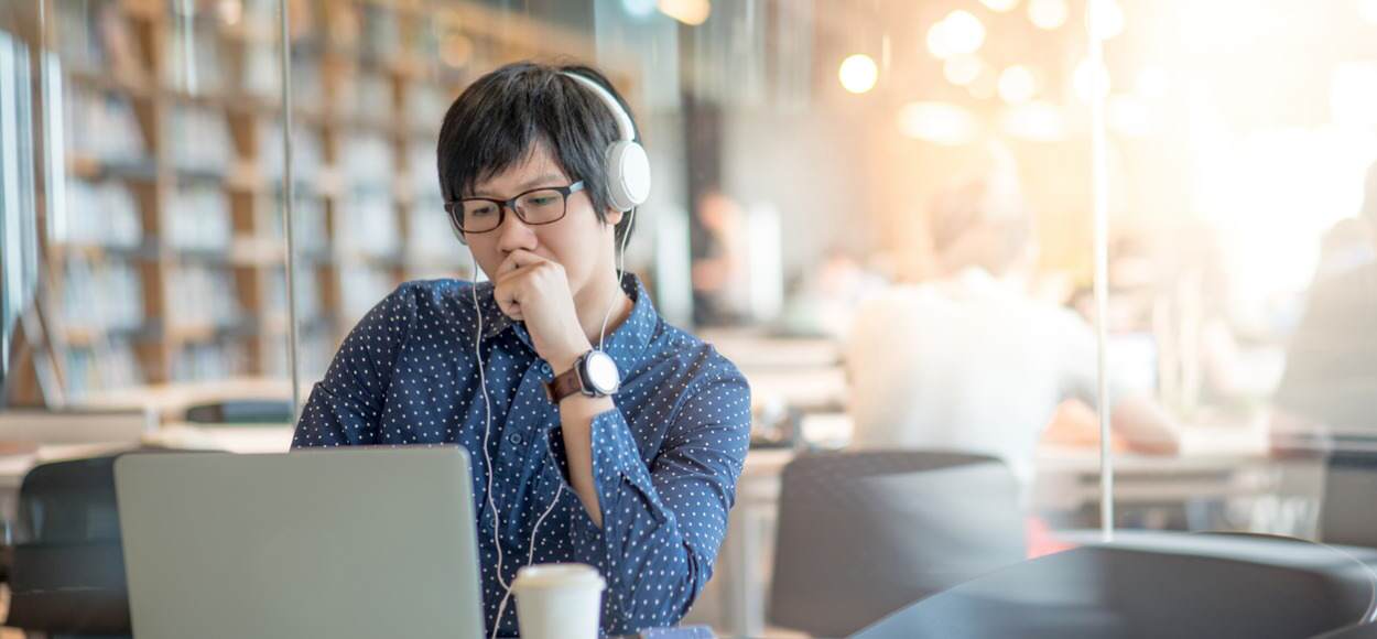 Young asian man working on laptop