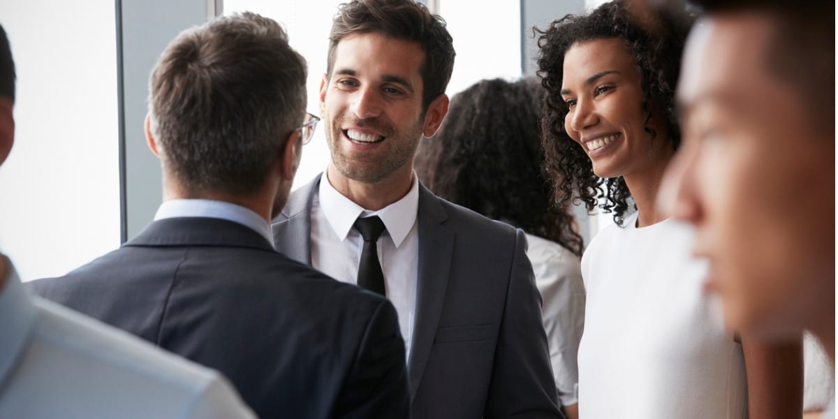 Business people smiling and networking