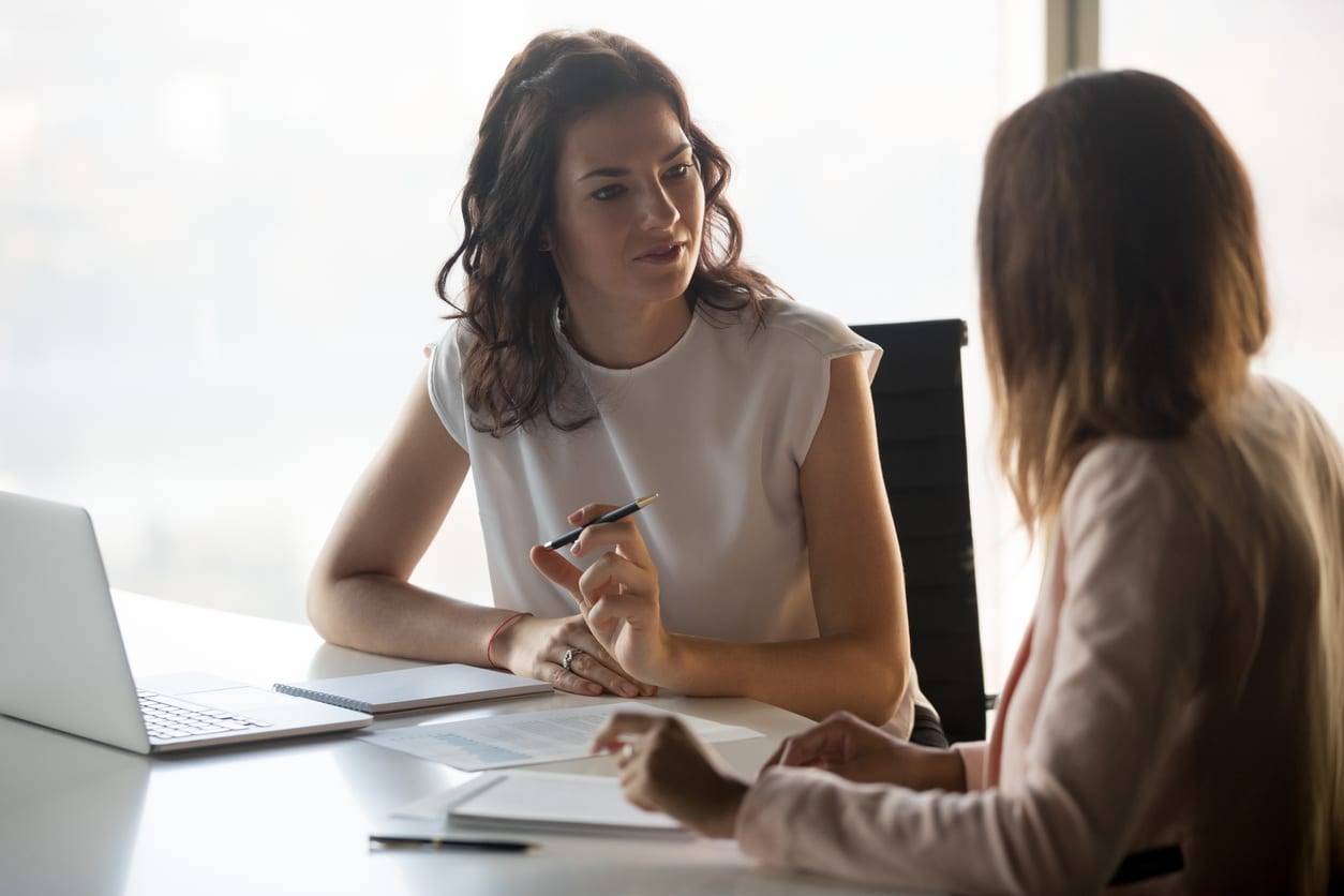 Two business women talk about strategy