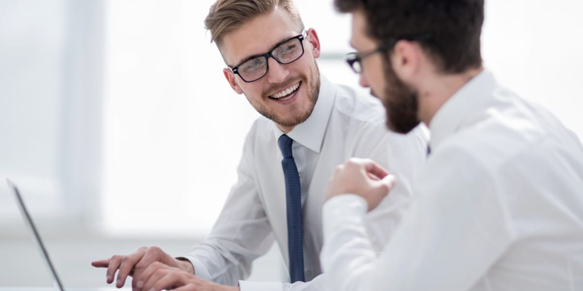 Two employees laughing with eachother