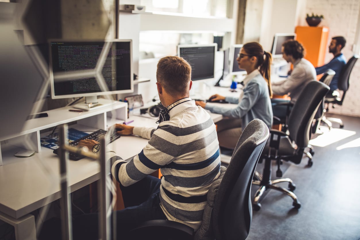 Computer programmers conducting testing