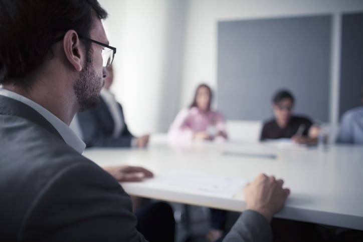 Man sitting at business meeting office table