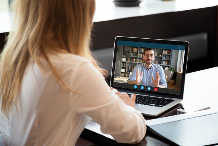 woman talking to boss over video call