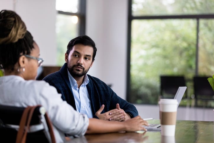 man listening to his manager