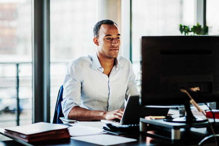 man looking at his computer screen