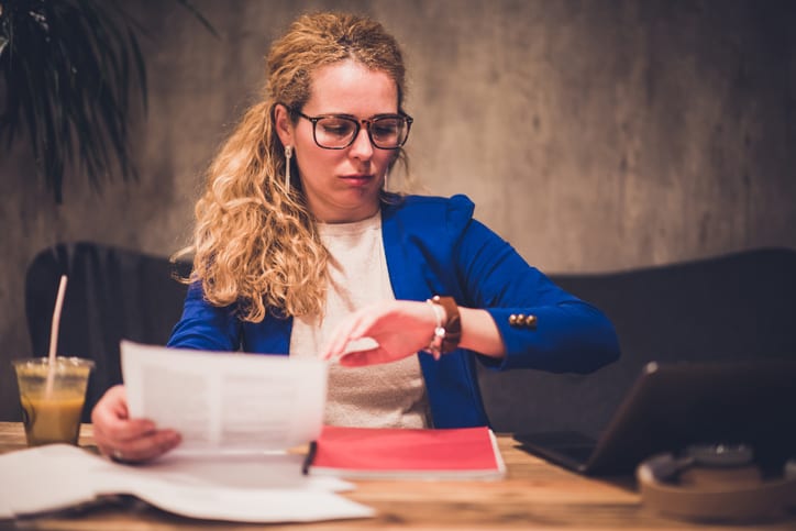 businesswoman looking at her watch