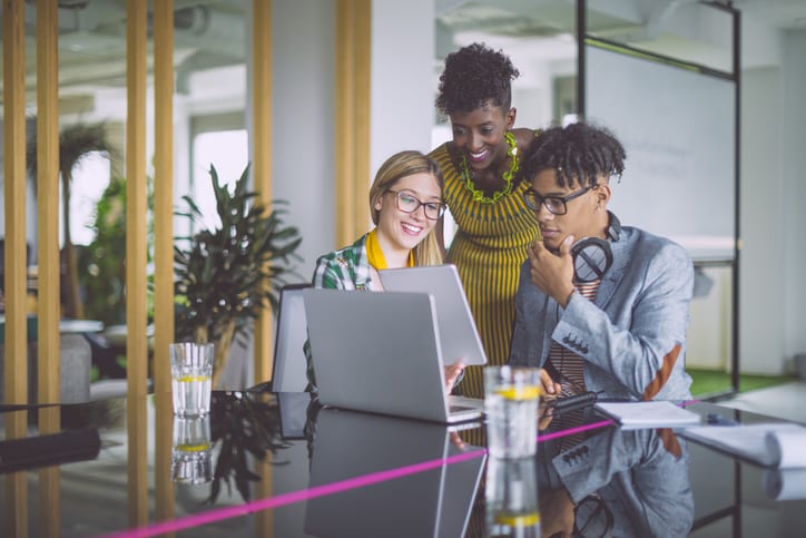 business team looking at laptop