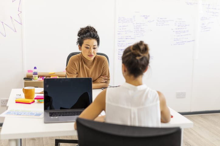 women talking in interview