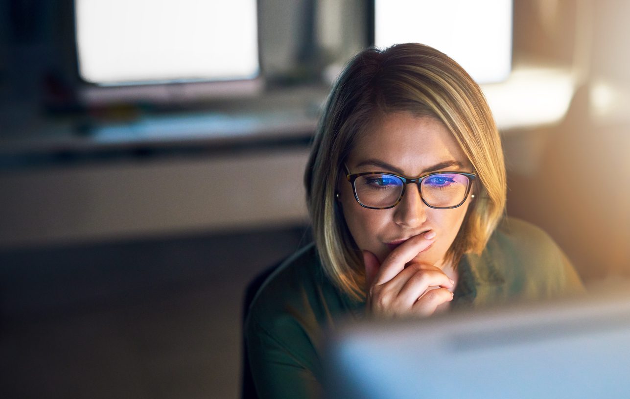 woman looking at her computer screen