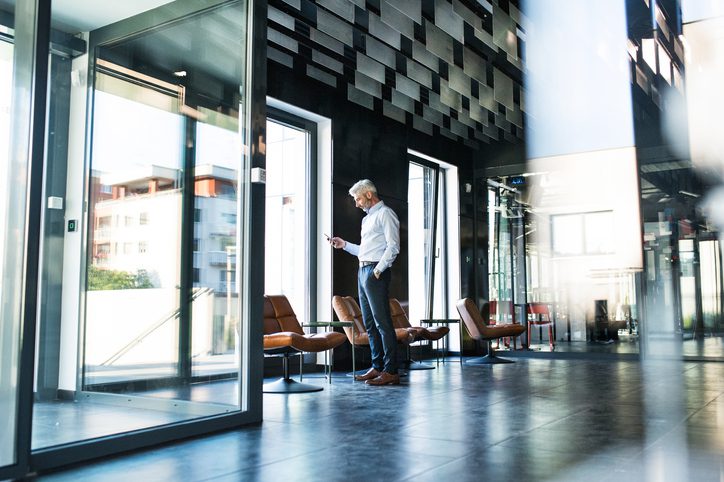 businessman looking at his phone