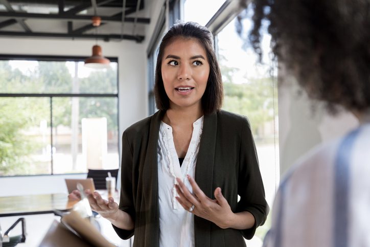 businesswoman talking to her colleague