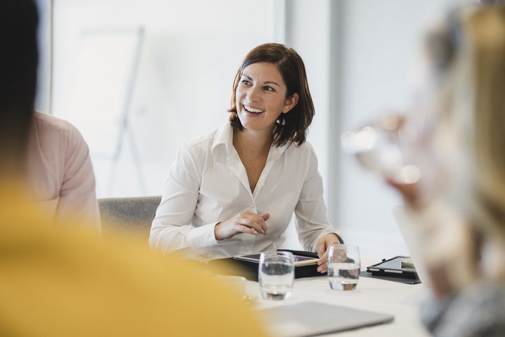 businesswoman speaking to group