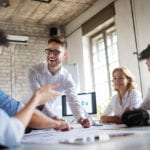 Businessman laughing in meeting