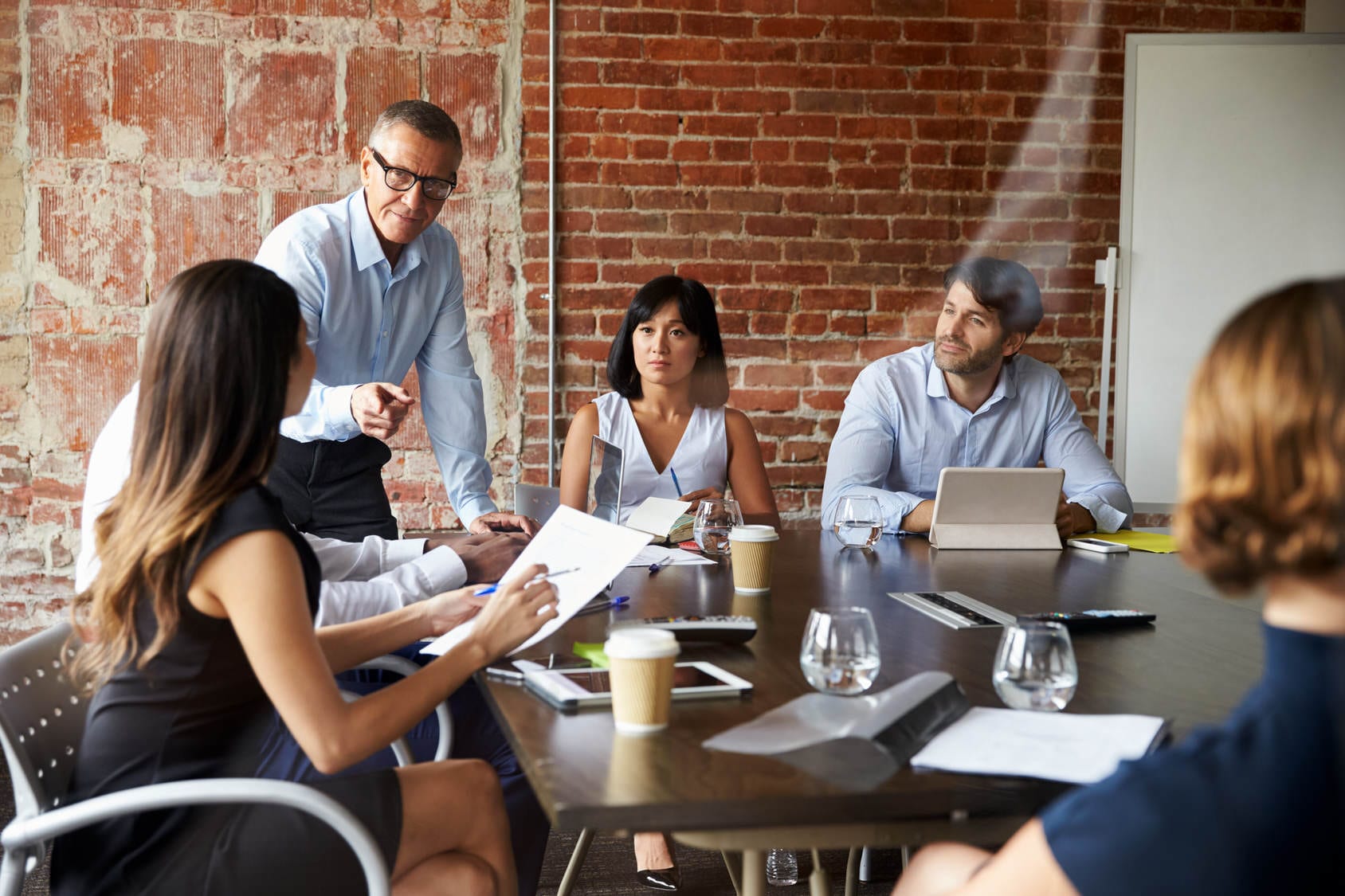 Business people Meeting In Modern Boardroom Through Glass