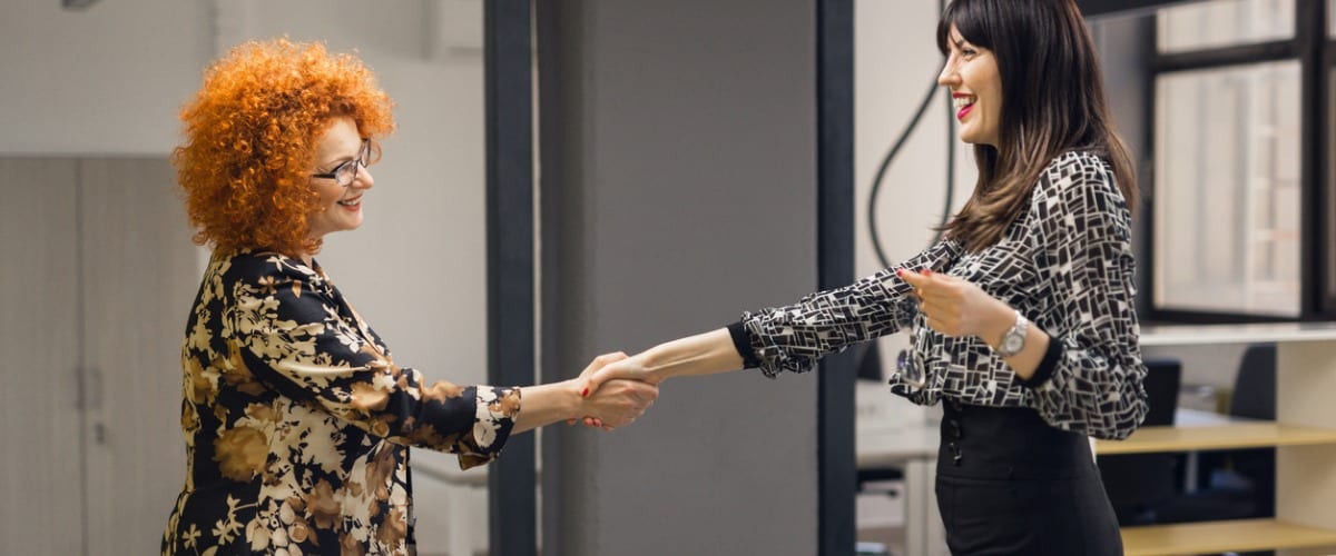 businesswomen shaking hands