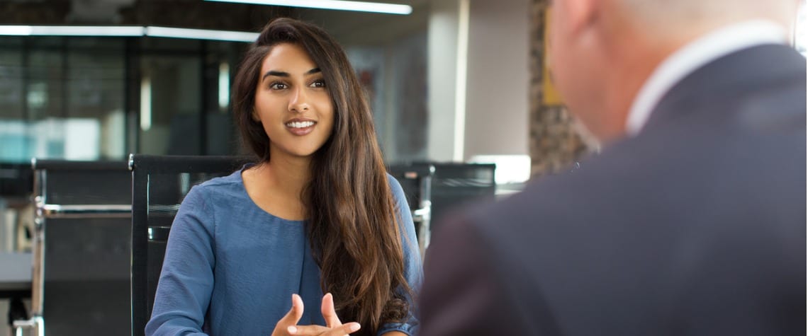 Woman being interviewed by man