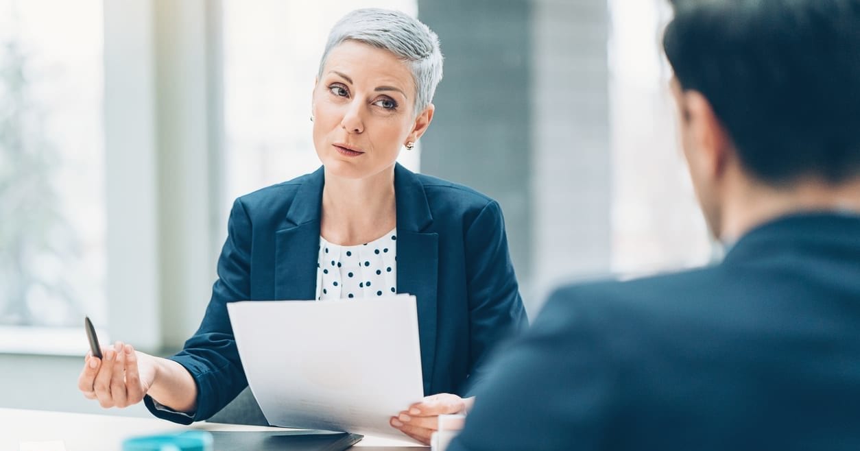 Two businesspersons talking in the office