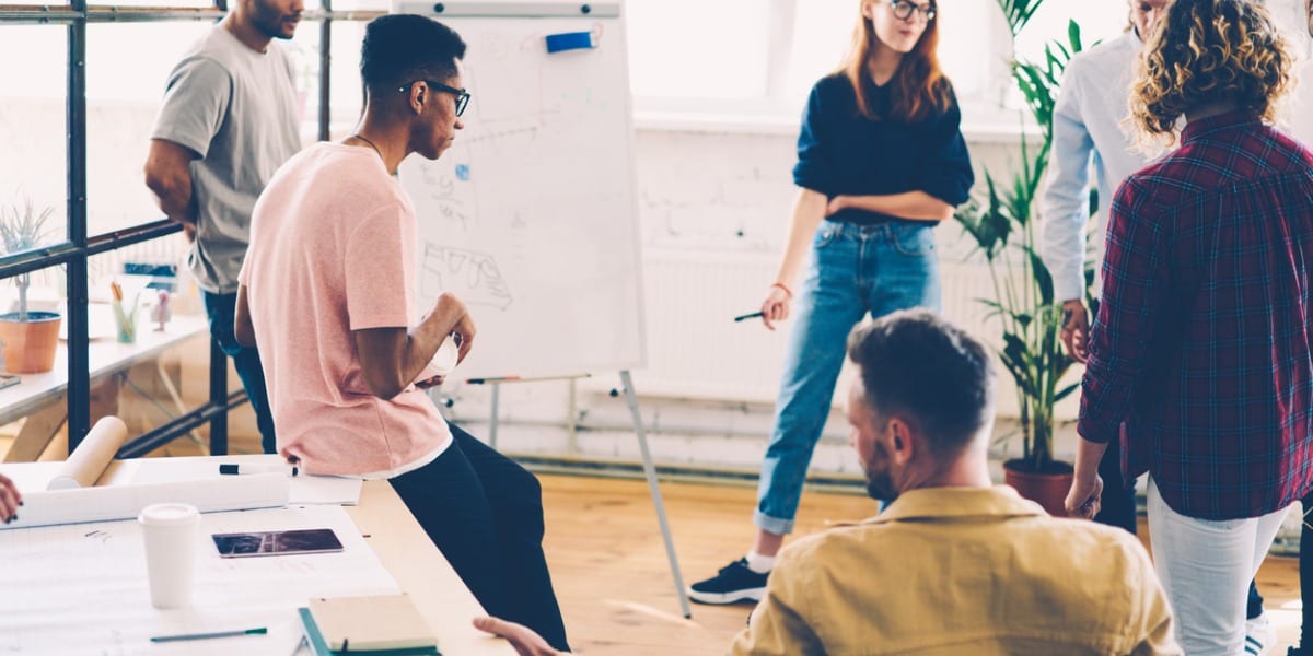 Group of young employees in discussion