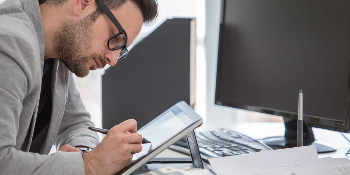 man working on tablet