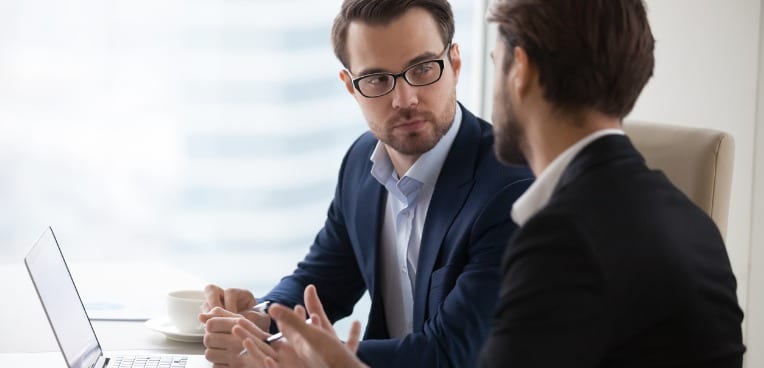 image of two businessmen discussing plans