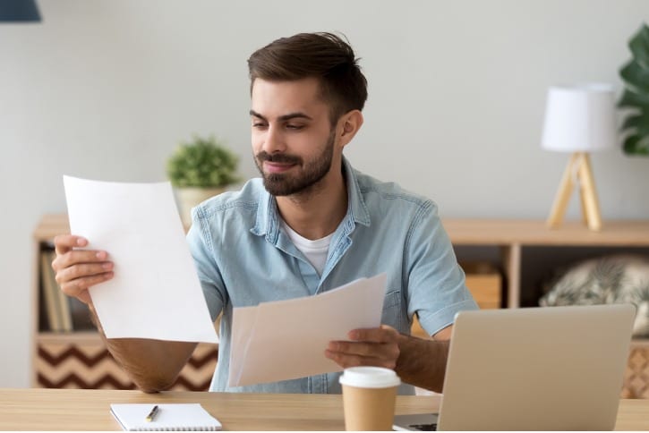 man checking over his CV