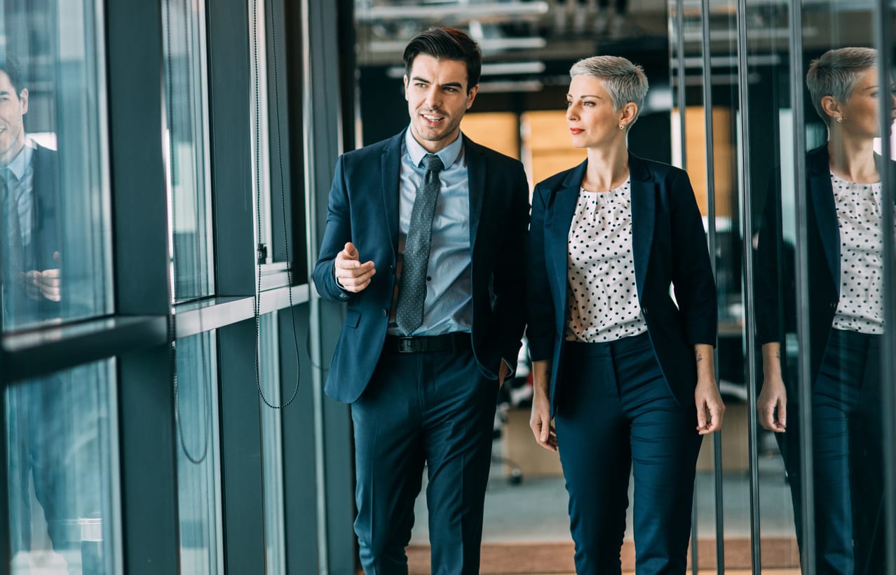 Two business people taking