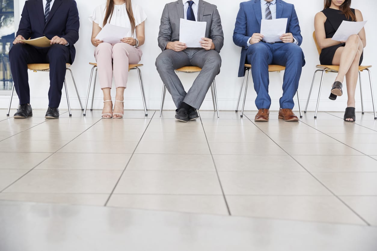 Five candidates waiting for job interviews, front view, crop