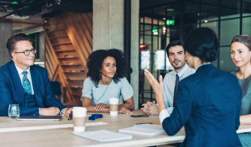 Multi-ethnic group of business persons discussing business