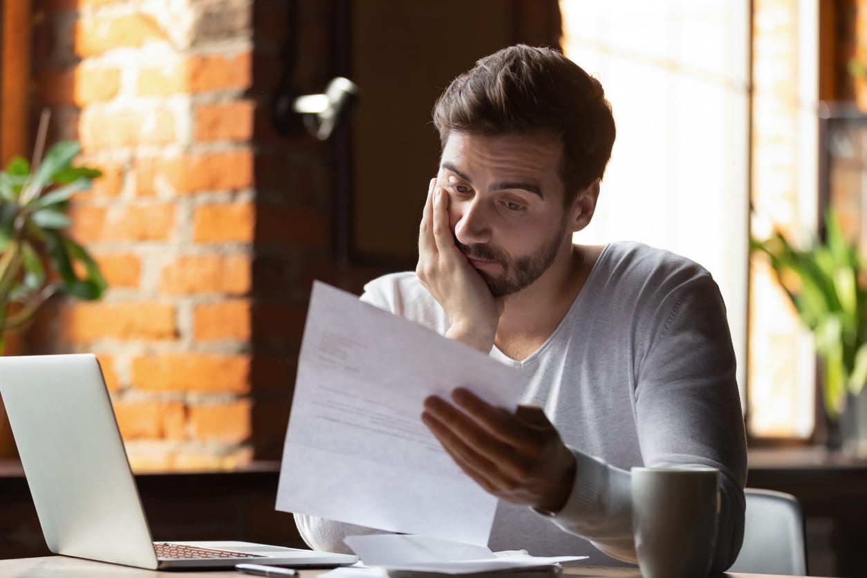 unsuccessful job candidate reading a letter