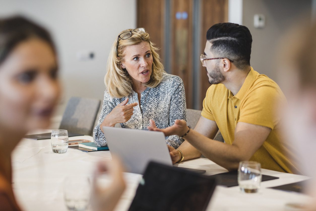 businesswoman talking to employee