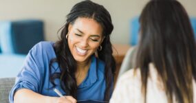 Female business owner smiles while conducting interview