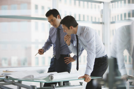 Businessmen working together in office