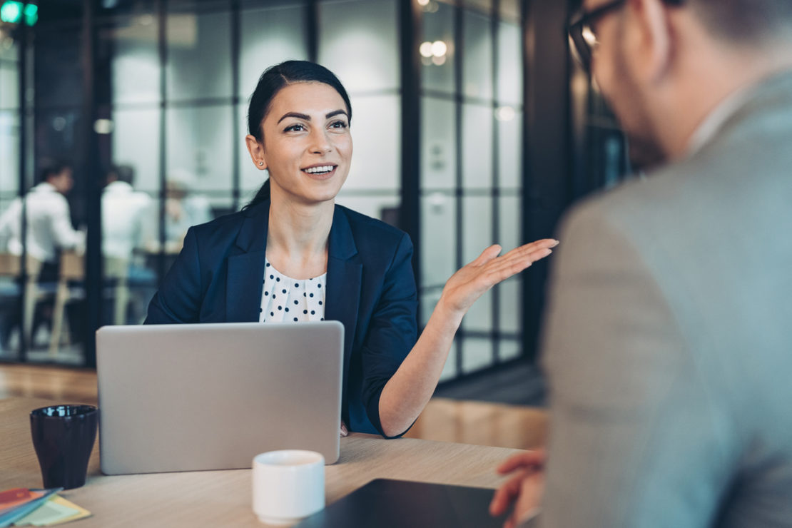 Businesswoman talking to a colleague