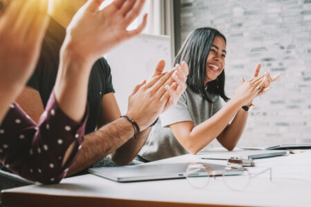 closeup photo of partners clapping hands after business seminar