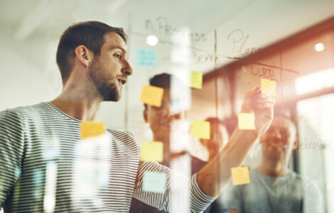 Cropped shot of a group of young designers using sticky notes during a brainstorming session