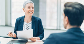 Two businesspersons talking in the office