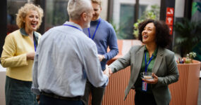 male and female business people introducing each other