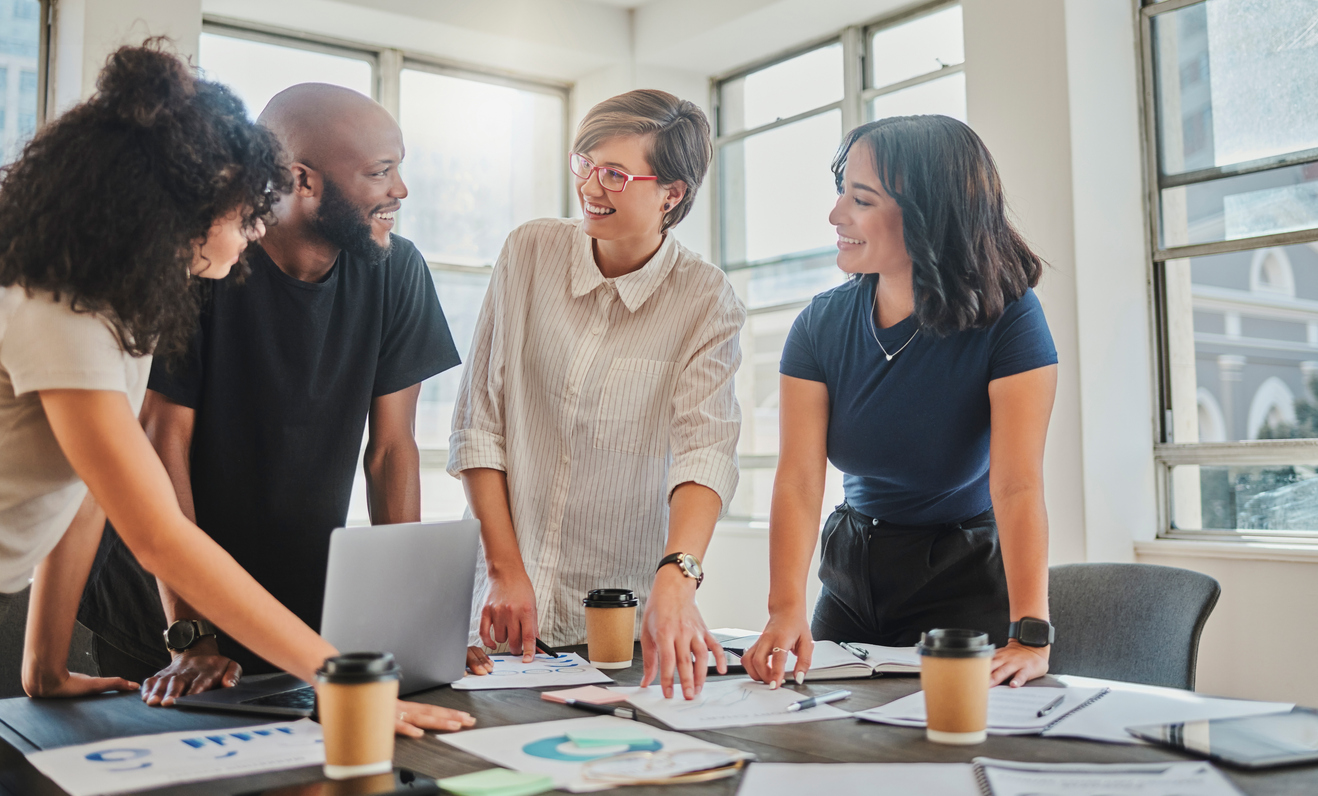 Group of four employees in a casual meeting