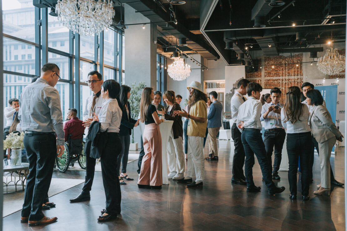 Big room of employees networking 